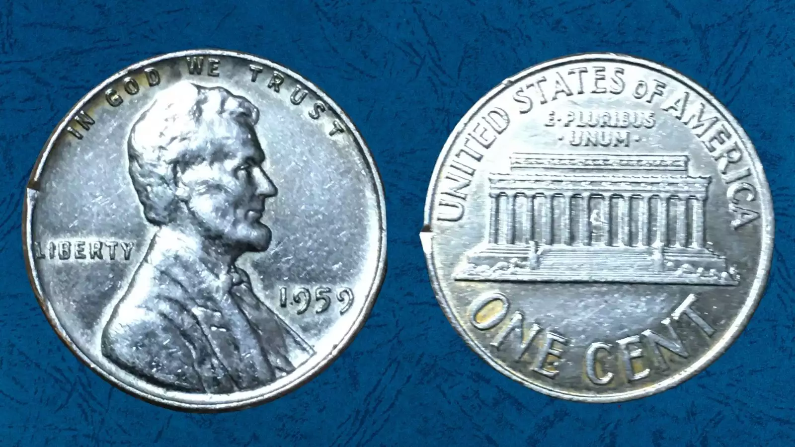 1959 Lincoln cent struck on silver Roosevelt dime planchet showing silver color and smaller diameter